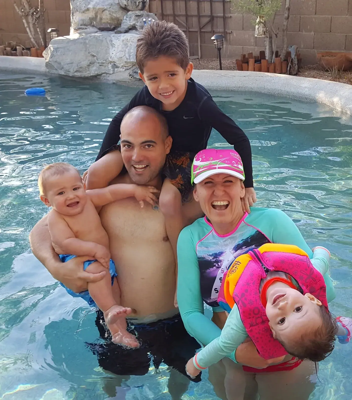 Waste Wizards owner Alex Padron enjoying time in the pool with his family