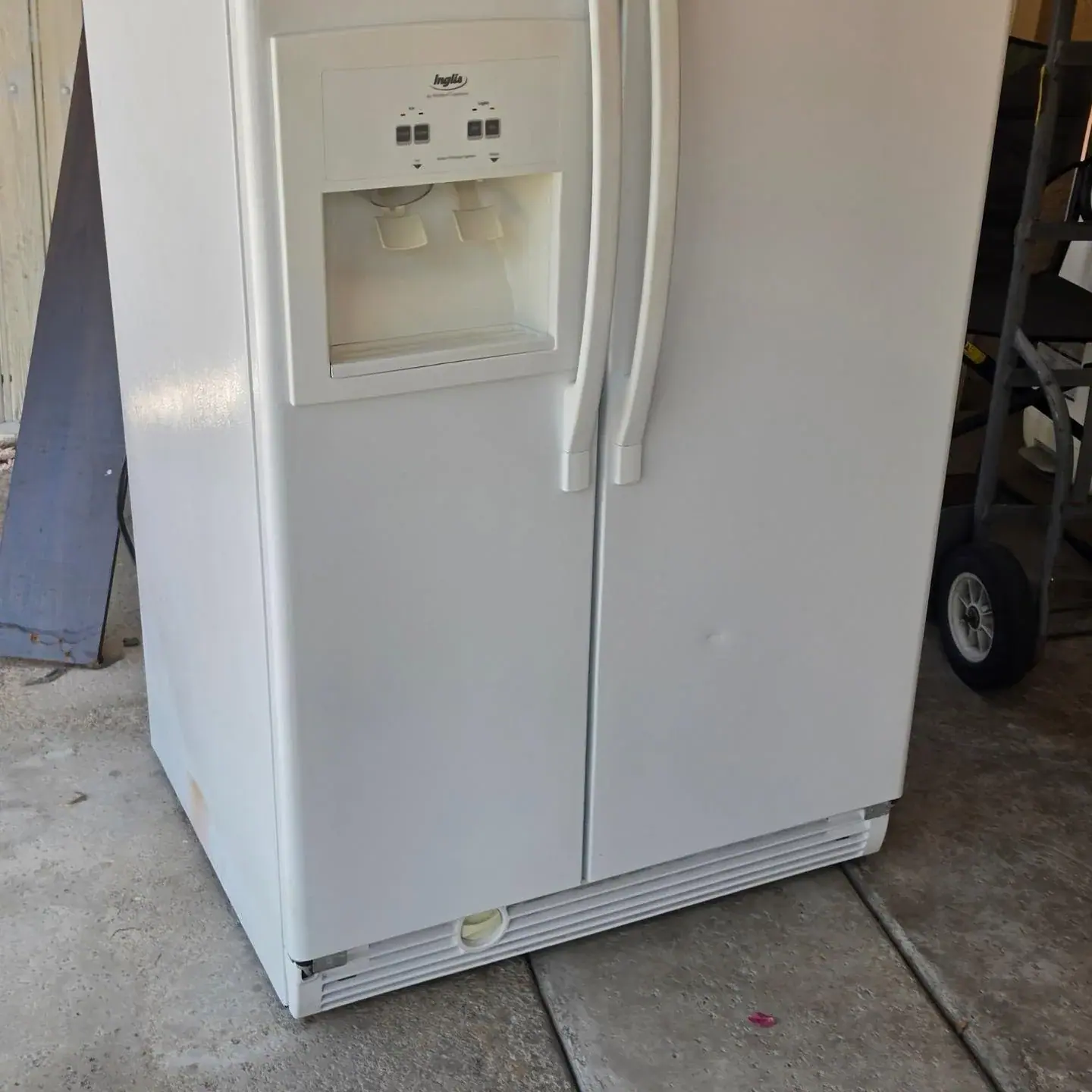 White refrigerator awaiting appliance removal in Scottsdale